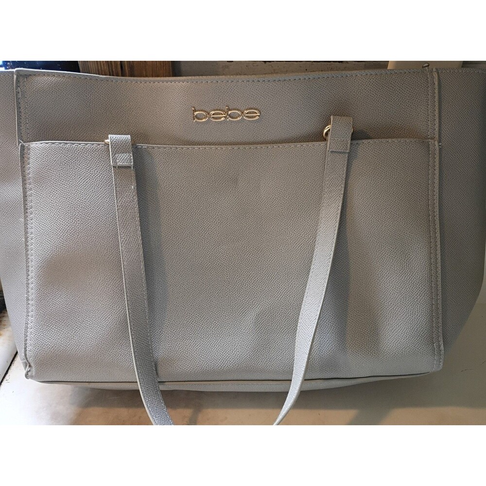 Bebe Faux-leather Tote Bag featuring a gold embossed logo